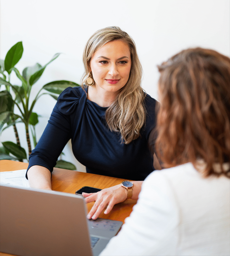 Aga Asbury a Maine based immigration attorney in a business meeting discussing green card options
