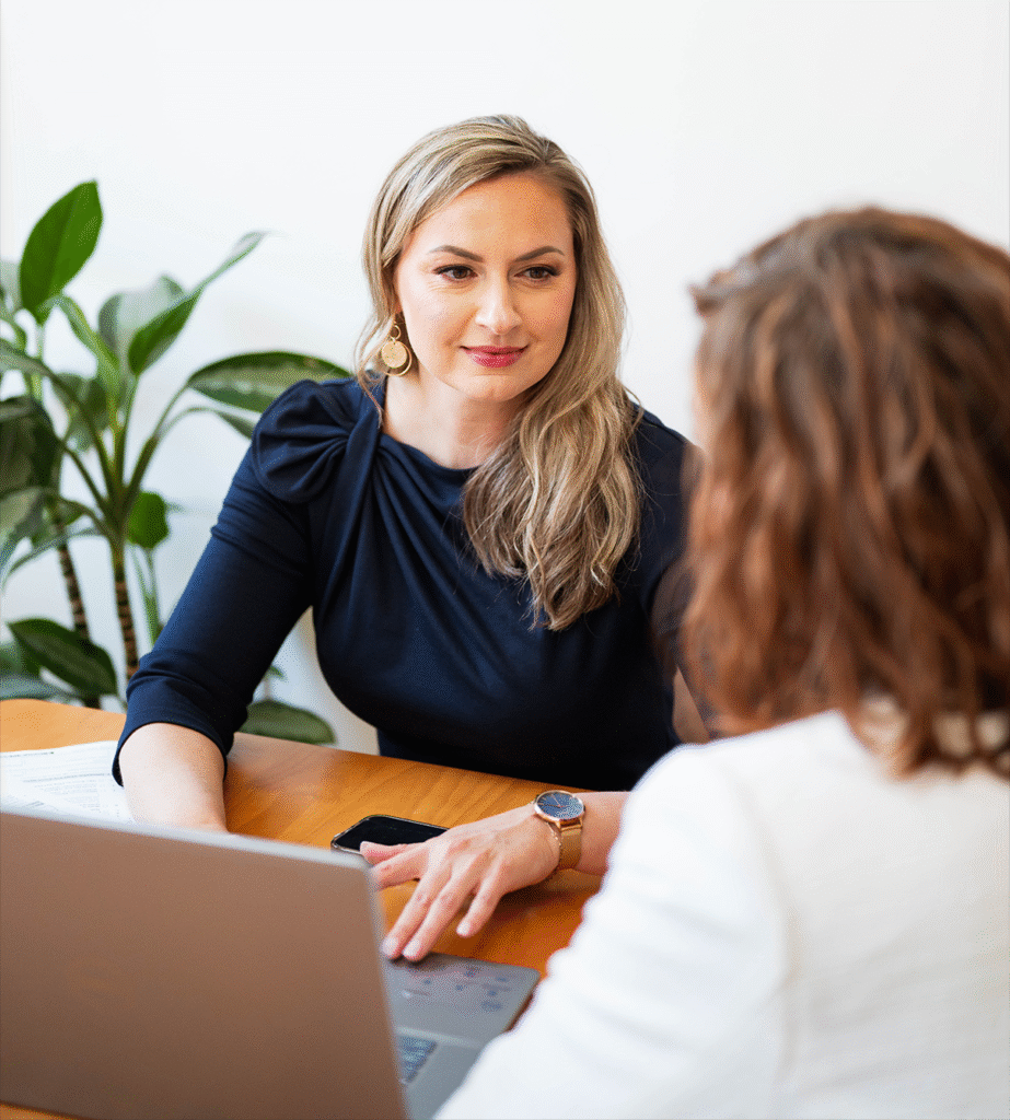 Aga Asbury a Maine based immigration attorney in a business meeting discussing green card options