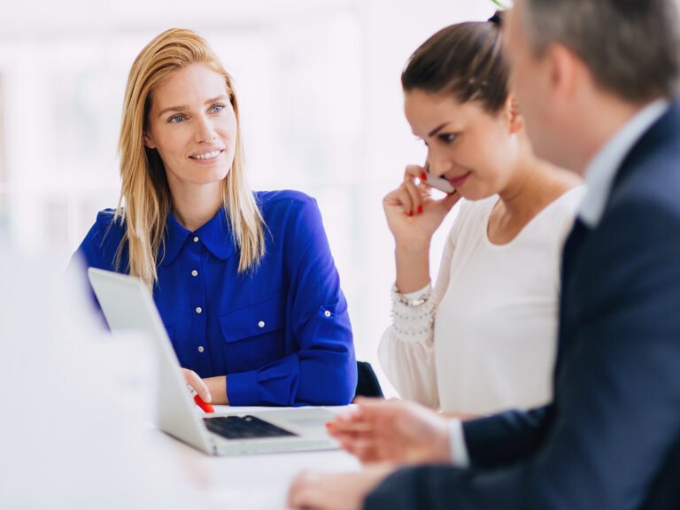 Female immigration lawyer explains the immigration journey to visa applicants in a meeting