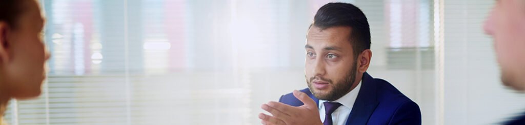 He discusses immigration application with interested applicants to help them avoid immigration application traps