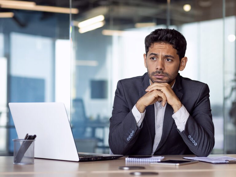 A foreign businessman considering how to meet E2 visa requirements as an investor