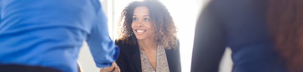 She discusses reasons for visa denial with people who will help her through her situation during a consultation