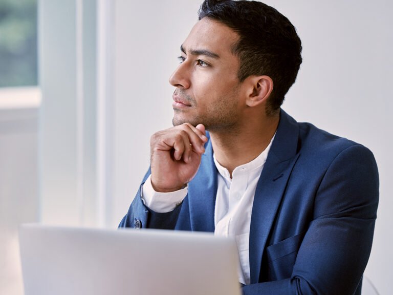 An investor thinking about his l-1 visa petition while working via laptop
