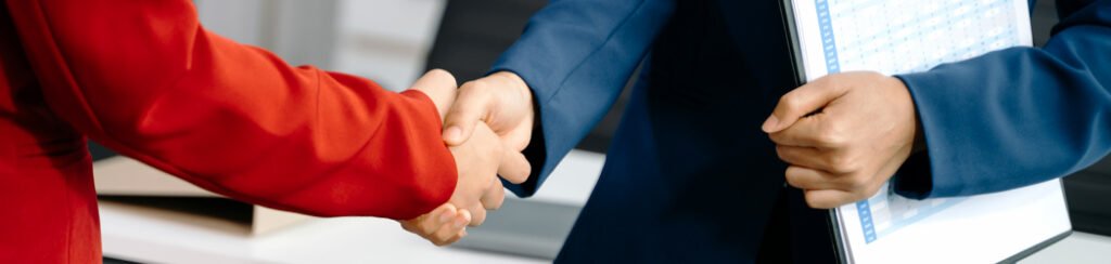 They shake hands while gathering documents for an immigration request for evidence