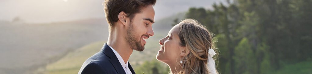 A couple looking into each other after they applied for a spouse visa